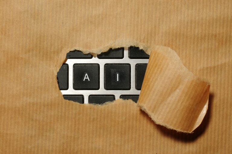 close up image of a keyboard wrapped in brown paper with the letters AI exposed