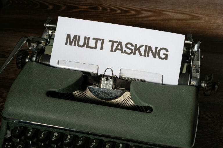 old style typewriter with a piece of paper saying multi tasking